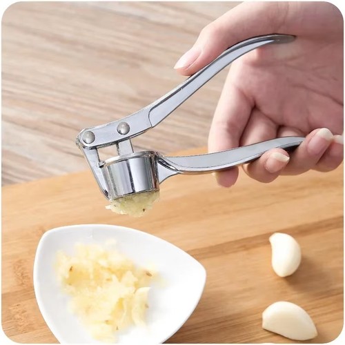Stainless steel garlic press - garlic,